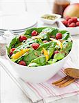 Spinach salad with raspberries, mango and vinaigrette