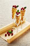 Puff pastry cones with cream and raspberries