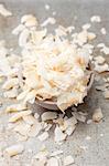 Coconut flakes in a grey bowl