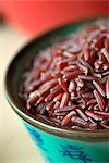 Red rice in an oriental bowl (close-up)