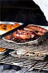 Grilled sausage and vegetables on a barbecue