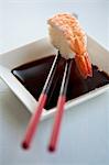 Soy sauce with a prawn nigiri sushi