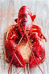 Cooked lobster on chopping board