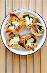 Filo pastry packets filled with feta cheese and spinach (Greece)