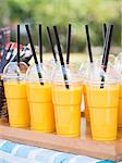 Mango lassis in take away plastic cups sold on a market stall