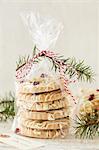 White chocolate biscuits with pistachios and cranberries in a cellophane bag as a gift