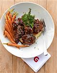 Oxtail ragout on mashed potatoes and parsnips with carrots