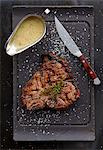 Grilled T-bone steak with gravy