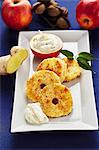 Fried apple and coconut rings with ginger and quark cream