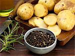 peppercorn and rosemary with sliced potatoes