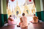 Buddhist Nuns praying at Shwedagon Pagoda (Shwedagon Zedi Daw) (Golden Pagoda), Yangon (Rangoon), Myanmar (Burma), Asia