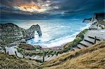 A winter sunset at Durdle Door on the Jurassic Coast, UNESCO World Heritage Site, Dorset, England, United Kingdom, Europe