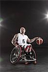 Wheelchair basketbal player with the ball