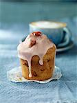 Strawberry muffin on blue tablecloth