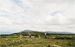 Hikers photographing each other in landscape, Ural Mountains, Russia