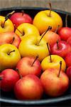 High angle view of plate of red and yellow apples