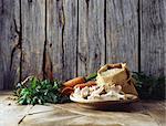 Carrots, coriander, mushrooms and pearl barley in burlap sack