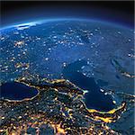 Night planet Earth with precise detailed relief and city lights illuminated by moonlight. Caucasus and the Caspian Sea. Elements of this image furnished by NASA