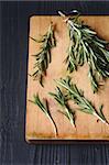 Freshly picked rosemary on a wooden background