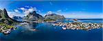 Breathtaking aerial panorama of fishing town Reine and surrounding fjords on Lofoten islands in Norway, famous tourist destination