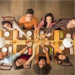 Group of people toasting and looking happy at a restaurant