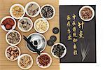 Chinese medicinal herb ingredients, acupuncture needles, moxa sticks and i ching coins, with calligraphy on old grey paper. Translation describes acupuncture chinese medicine as a traditional and effective medical solution.