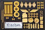 Dried italian pasta food selection with old metal kitchen sign forming an abstract background over slate.