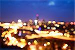 City Lights at Night. Blurred Photo with Bokeh. Abstract Urban Background.