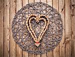 Handmade heart on a wooden background