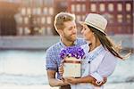 Attractive couple with a bouquet of flowers