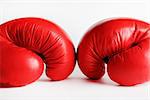 A pair of red boxing gloves. Sports concept.