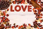 Valentines Day background with love text and orange brown dried plants