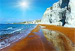 Xi Beach with red sand. Morning view with sunshine (Greece, Kefalonia, Ionian Sea).