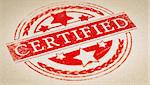Rubber stamp imprint over paper background with the text certified. Concept image for illustration of certification or authenticity certificate.
