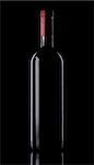 Elegant bottle of red wine on black background