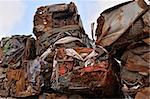 A pile of compressed cars in blocks for processing.