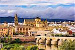 Cordoba, Spain at the Roman Bridge and Mosque-Cathedral on the Guadalquivir River.