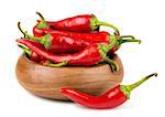 Red hot chili peppers in wooden bowl on white background