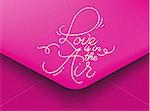 Pink greeting envelope on Valentines day lettering love is in the air, I love you