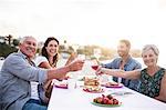 Cute family having dinner on the beach