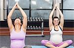 Pregnant women doing yoga exercise at the leisure center