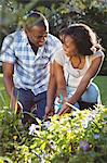 Ethnic couple doing some gardening outside