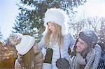 Happy family in winter clothes on a beautiful snowy day