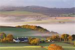 Cottages surrounded by idyllic rolling countryside, Dartmoor National Park, Devon, England, United Kingdom, Europe