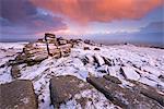 Colourful sunrise above snow covered moorland, Belstone Tor, Dartmoor, Devon, England, United Kingdom, Europe