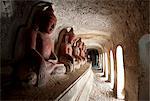 Buddha statues in one of the 947 Hpowindaung sandstone caves, 18th century paintings on the walls, Monywa, Sagaing District, Myanmar (Burma), Asia