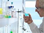 Chemist preparing chemical formula for testing in laboratory