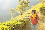 Young woman in tea plantations near Munnar, Kerala, India