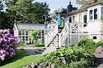 Exterior of weekend cottage and greenhouse