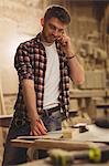 Carpenter working on his craft in a dusty workshop